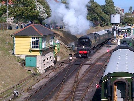 Steam locomotive pulls out of swanage station